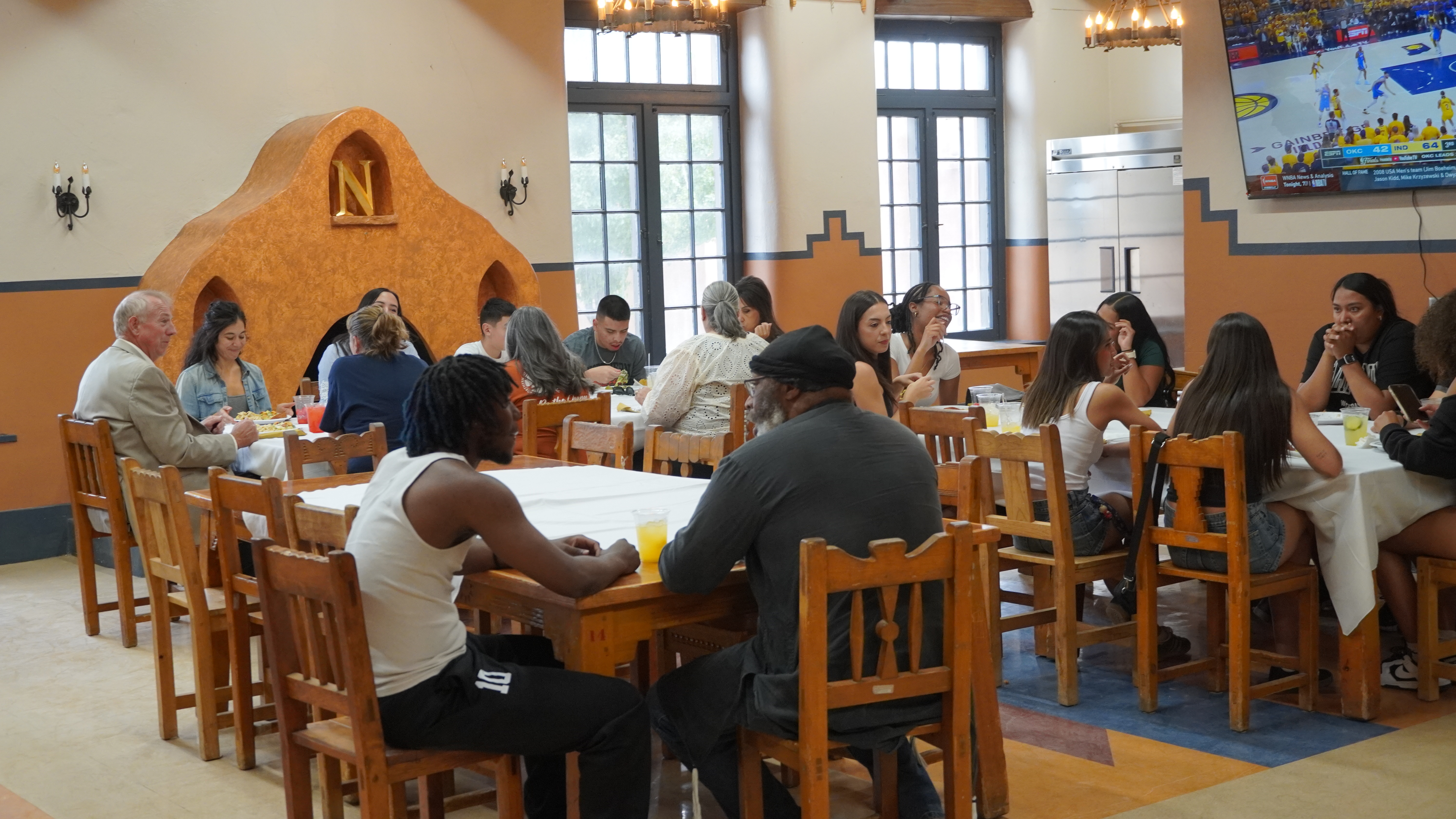 Students having dinner with family and friends on move-in day at El Rito Campus